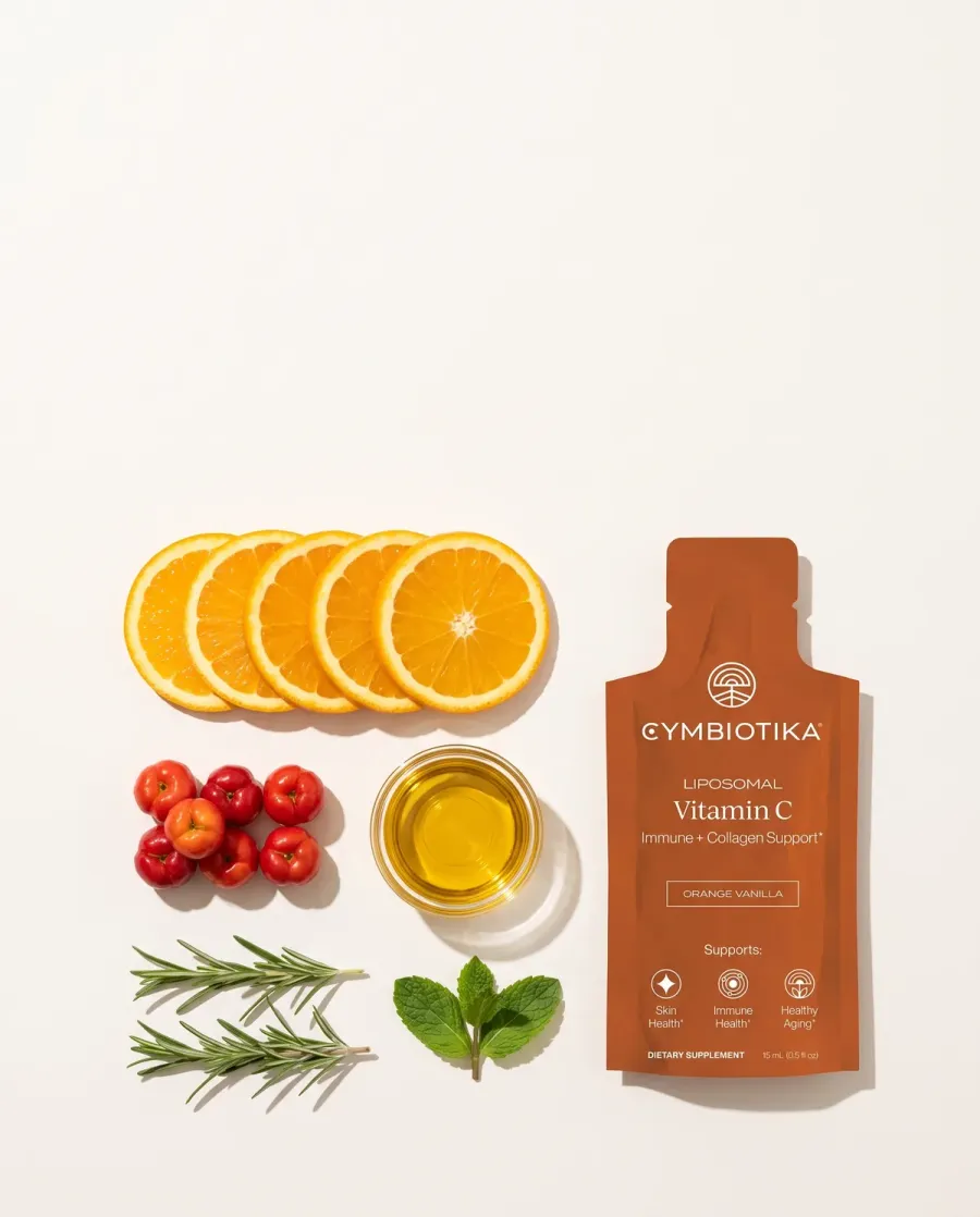 Cymbiotika Liposomal Vitamin C with raw ingredients laid out in a grid